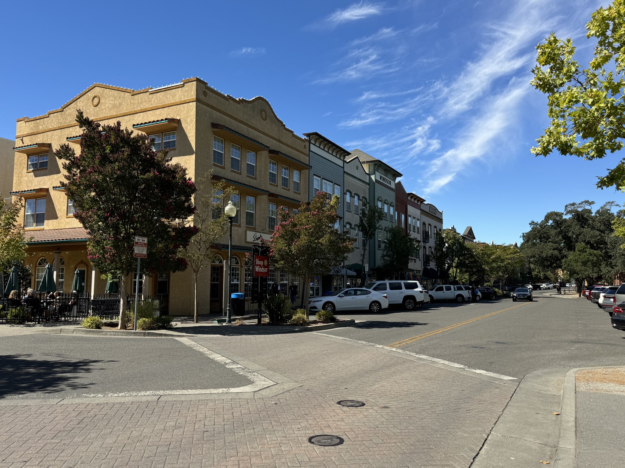 Storefronts on the Windsor Town Green on a clear day.